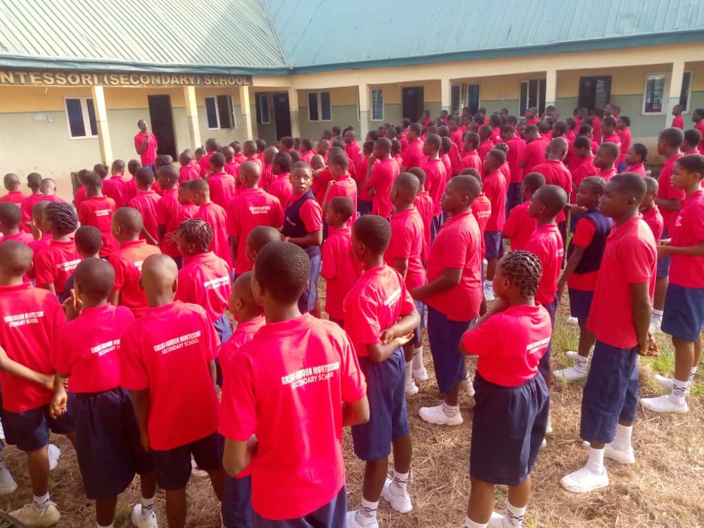 Great-Favour Montessori Secondary School Assembly in Red Sportswear