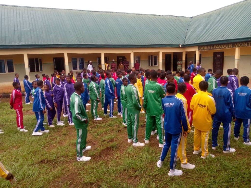 Students assembled for Great-Favour Inter-House Athletics Gala in team tracksuits